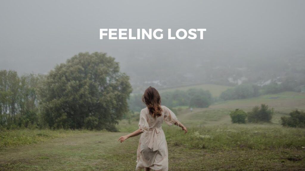 Young woman walking alone in a misty field, feeling lost and uncertain in her 20s